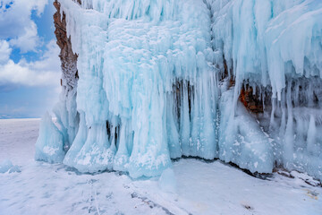 Blue ice cave grotto winter lake Baikal Olkhon island, Russia. Frozen clear icicles, beautiful landscape