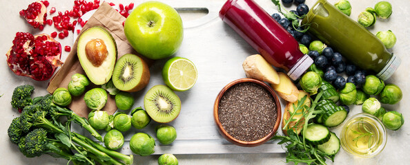 Assorted detox smoothie juices on light background.
