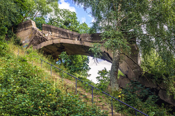 Old ruined railroad bridge over Sapina river in Kruklanki village, Poland