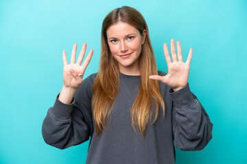 Young caucasian woman isolated on blue background counting nine with fingers