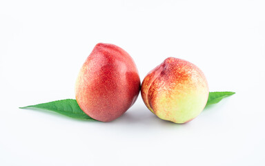 Fresh nectarines on white background