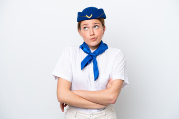 Airplane stewardess woman isolated on white background making doubts gesture while lifting the...
