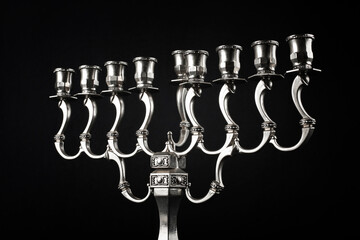Silver Hanukkah Menorah on a black background