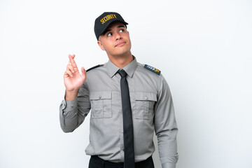 Young caucasian security man isolated on white background with fingers crossing and wishing the best
