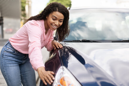 Excited African American Lady Touching Her New Auto