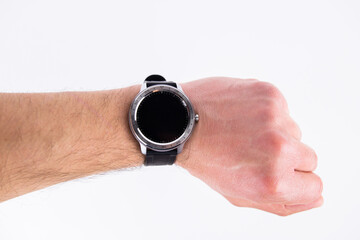 round smart watch on a male hand on a white background