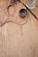 Artist's tools. Brush, paint, water bottle.