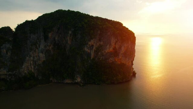 Aerial view from a drone flying over the bay. view of the rocky mountains and the beautiful sea during sunset. Asia at sea bay.  &ldquo;Underwater Wedding Beach&rdquo; Trang, Thailand. 4k drone footage
