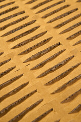 Brown wrapping corrugated cardboard with perforation. Kraft paper