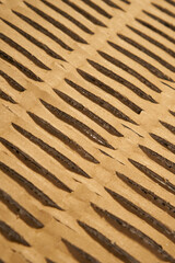 Perforated wrapping recycled brown paper. Corrugated grunge eco material with geometrical line pattern