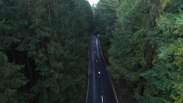 Aerial view of a person skating along the road at The Ardennes, Belgium.