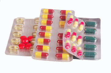 Medical pills and tablets in shells.Isolated on white.