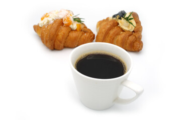 Cup Coffee and fruit croissant on white background.