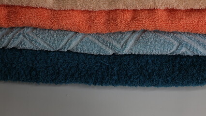 Multicolored cotton towels. Background for text, textural abstraction. Sketches of woven products. Soft, light background