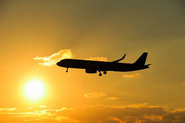 Fototapeta na wymiar airplane at sunset