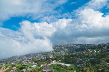 Obraz premium Highland landscape view of Baguio, Philippines with clouds in the blue sky