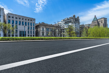 Naklejka premium Empty cement road and modern skyline.