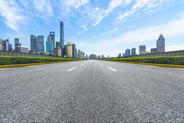 city road through modern buildings in shanghai