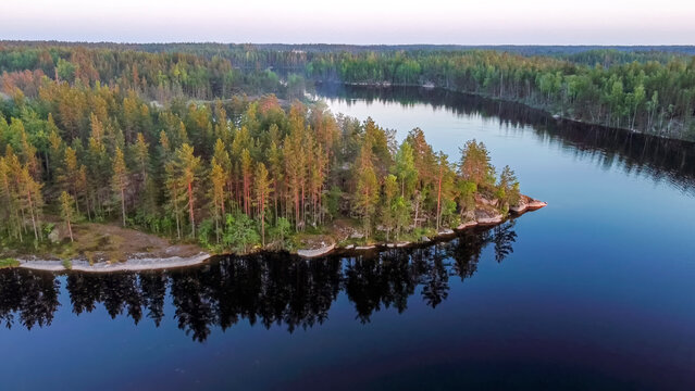 Flight over lakes and forests in Karelia near the village of Kuznechnoye in Russia.