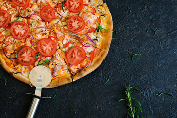 Vegetarian pizza, on a black concrete background. Pizza with tomatoes and cheese, and vegetables,...