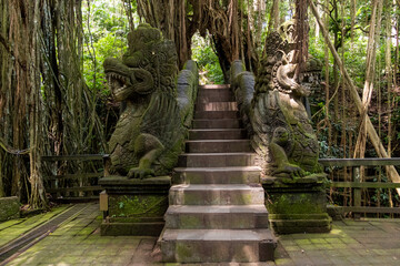 Famous bridge with Dragon sculpture at Monkey Forest Sanctuary in Ubud, Bali, Indonesia