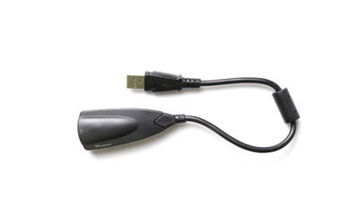 Black USB 2.0 external sound card audio adapter for headphones and microphone isolated on white background.