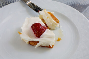delicious cheesecake with strawberries on plate
