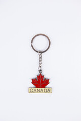 souvenir keychain with a maple leaf and the inscription Canada