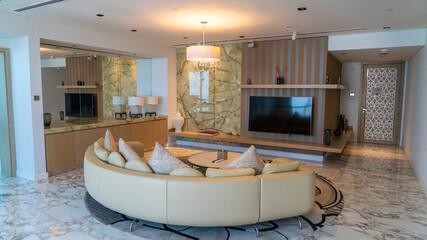 Abu Dhabi, UAE - February 2022: Interior of a suite room in Conrad Abu Dhabi Etihad Towers hotel.