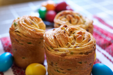 Easter cake and eggs on traditional ukrainian embroidered towel