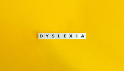 Dyslexia (Reading Disability) Word and Banner. Letter Tiles on Yellow Background. Minimal Aesthetics. - obrazy, fototapety, plakaty