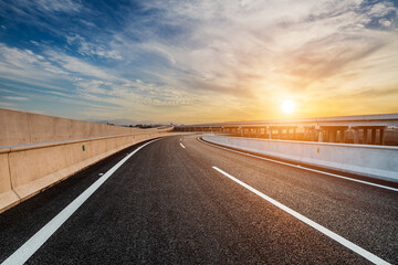Asphalt highway and beautiful sky cloud landscape at sunset. Road and sky cloud background.