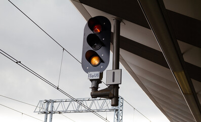 Railroad signals pole, railway signal lights for trains and suspended overhead electric power train...