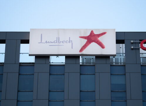 Lundbeck logo sign on Quattro B Tower building. Danish pharmaceutical company, signboard with brand logotype at Kraków Quattro Business Park center office complex on March 21, 2022 in Krakow, Poland.