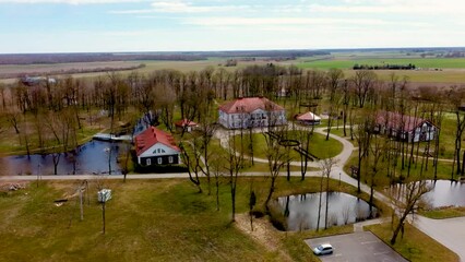 Amazing Aerial View Bistrampolis Palace and Parkin Lithuania, Panevezys District. Historic Palace in the Neoclassical Style. 4K UHD Resolution
