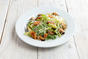 Seafood salad. In a plate. On a light background.