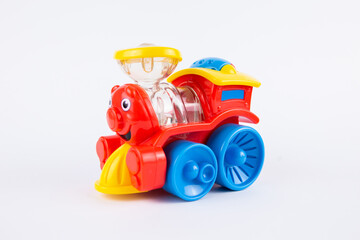 a children's plastic toy steam locomotive on a white background