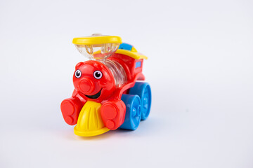 Fototapeta premium a children's plastic toy steam locomotive on a white background