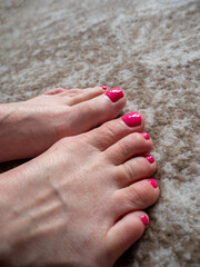 woman’s painted toe nails on white lady's feet