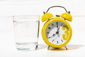 morning glass of pure water, conceptual photo on white background, closeup