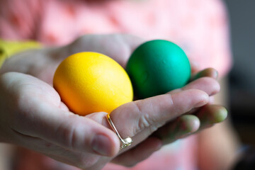 easter eggs in hand