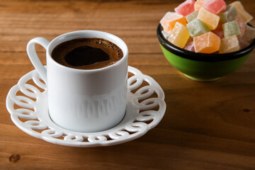 Traditional Turkish delight and Turkish coffee on a wooden background	