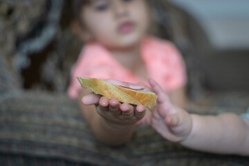 child holding a pumpkin