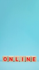 ONLINE - a word from wooden blocks with letters. Online growing business concept. The phrase online made from wooden blocks on blue background