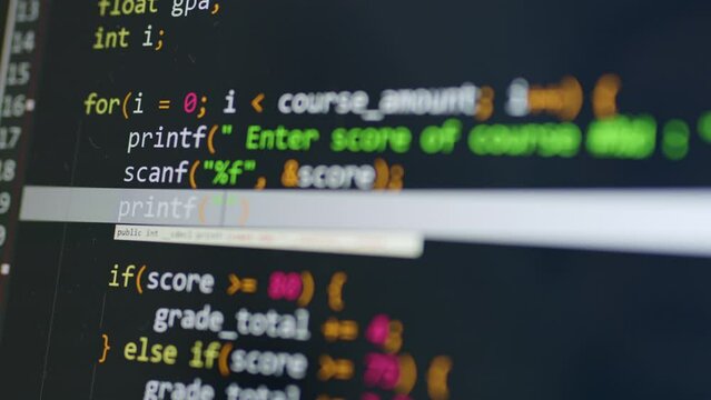 Close up of programmer computer screen typing code. Developer working on software source code program.