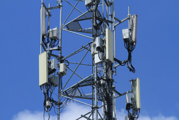 Telecommunication tower 4G 5G antenna on blue sky