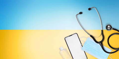 Ukraine medical protection aid concept, doctor stethoscope isolated on yellow and blue colors of the flag of Ukraine. Relief for the injured and refugees. Banner with copy space