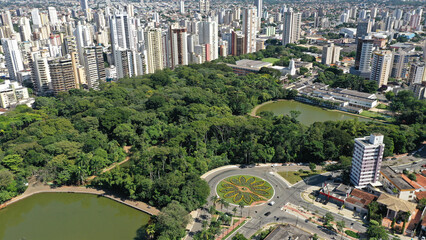 Panoramic view of a beautiful park with tropical trees surrounded by modern buildings in Goiania,...