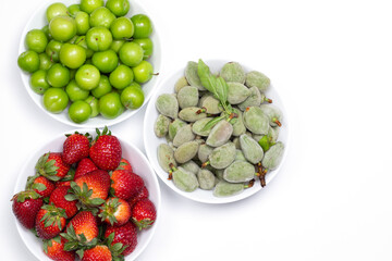 Fototapeta na wymiar srawberries, almond, plum at supermarket