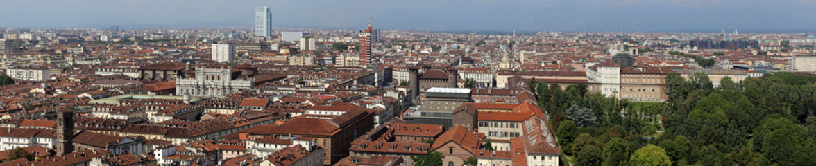 Fototapeta na wymiar Wide panorama of the city of Turin in the Piedmont Region in Northern Italy seen from the tall building called Mole Antonelliana